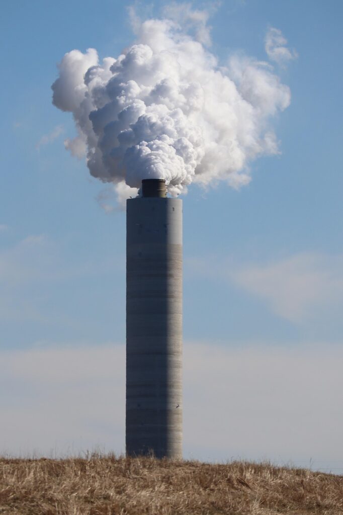 Industrial smokestack with smoke